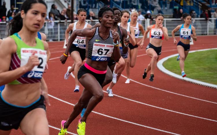 Athlete running around track